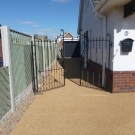 Gated entrance with resin bonded stone in Amber Gold