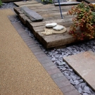 patio design with resin decking and slate