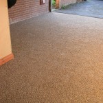 Resin Bonded resurfacing of garage floor concrete tarmac resin